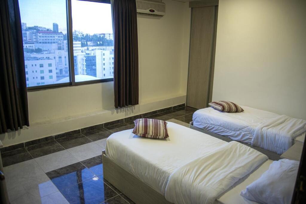 Bonsiana Hotel Suites Аман Екстериор снимка